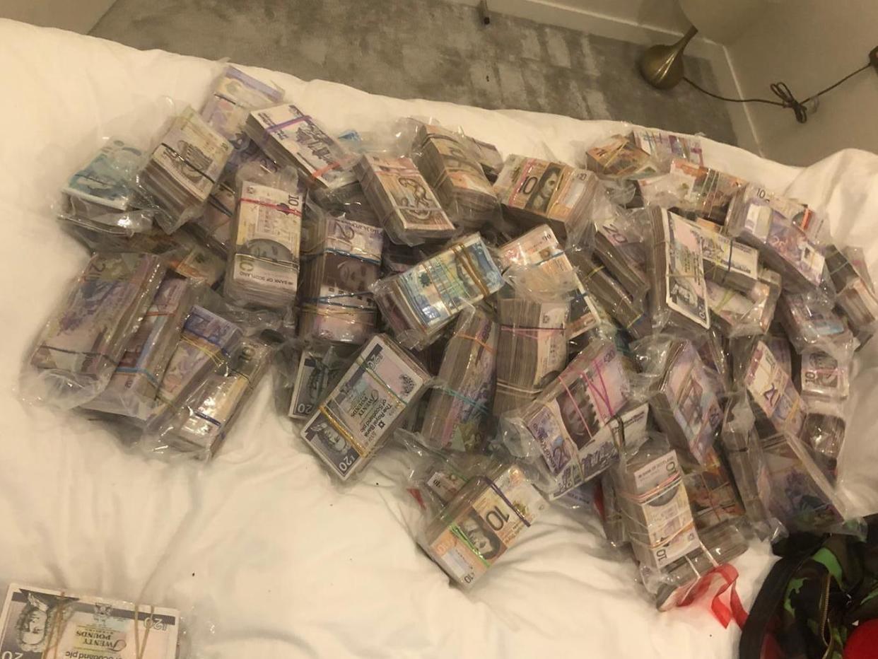 A quantity of cash seized by officers under Operation Venetic in London: Metropolitan Police
