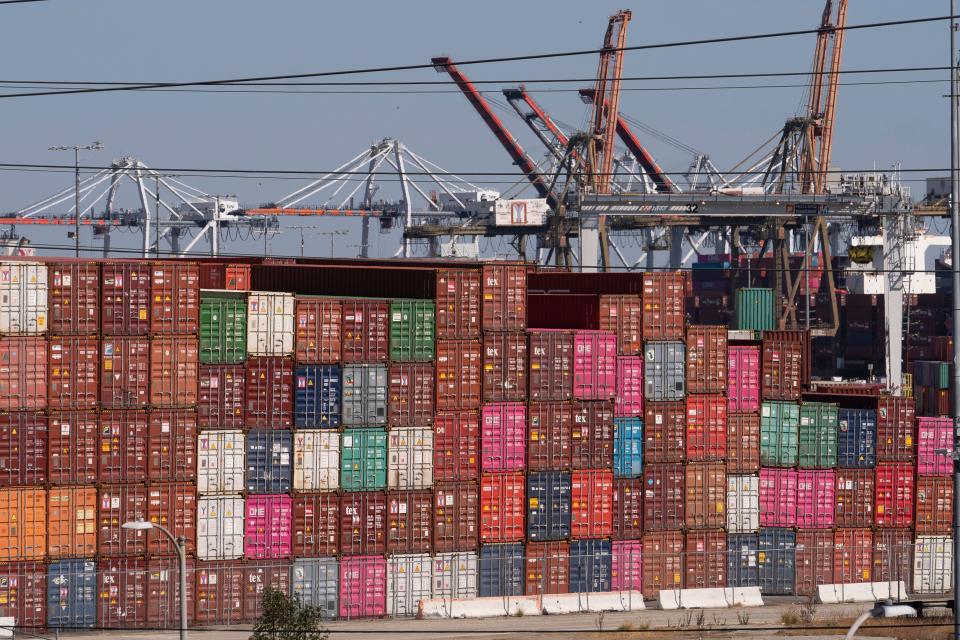 Cargo containers sit stacked at the Port of Los Angeles in San Pedro, Calif., Tuesday, Oct. 19, 2021.