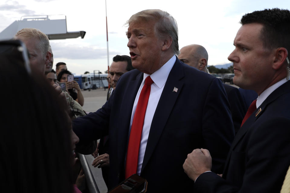 President Donald Trump greets supporters after arrivinf at Albuquerque International Sunport, Monday, Sept. 16, 2019, in Albuquerque, N.M. (AP Photo/Evan Vucci)