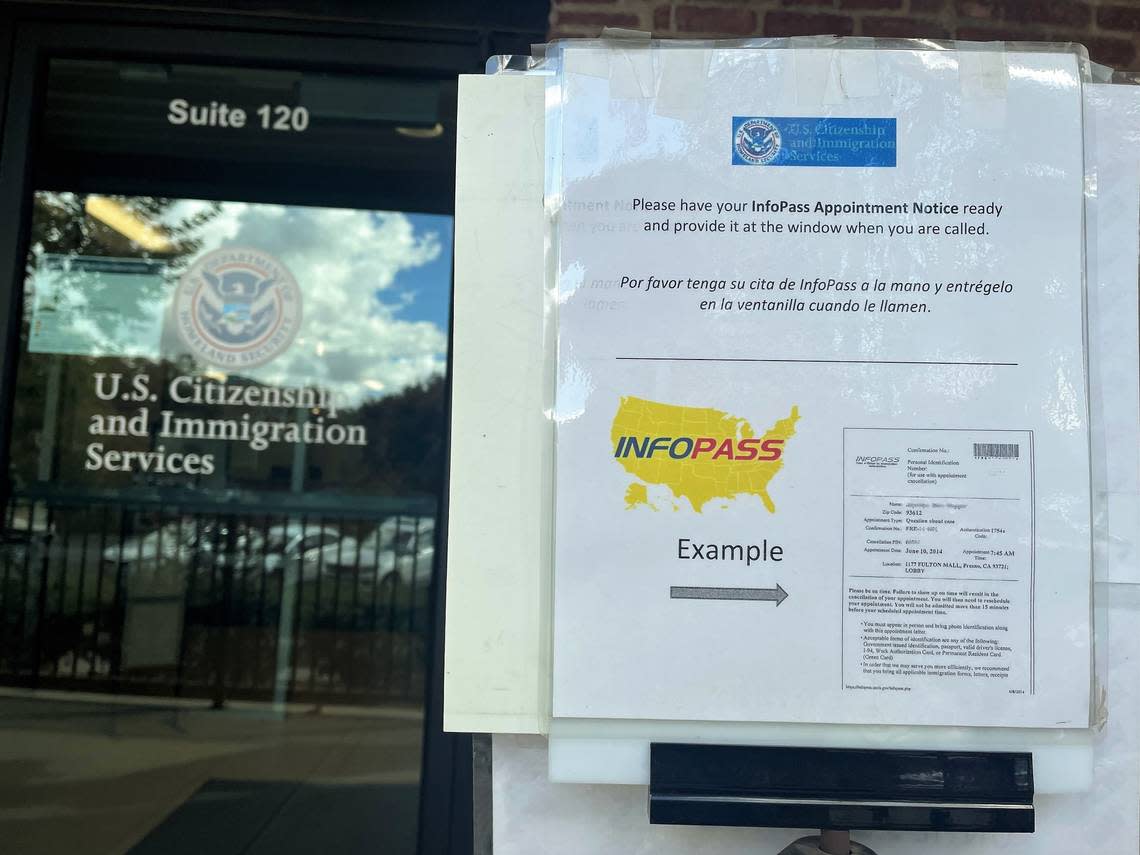 An example of an InfoPass appointment confirmation sheet was posted at the entry of the United States Citizenship and Immigration Services Fresno field office on Nov. 2, 2022. 