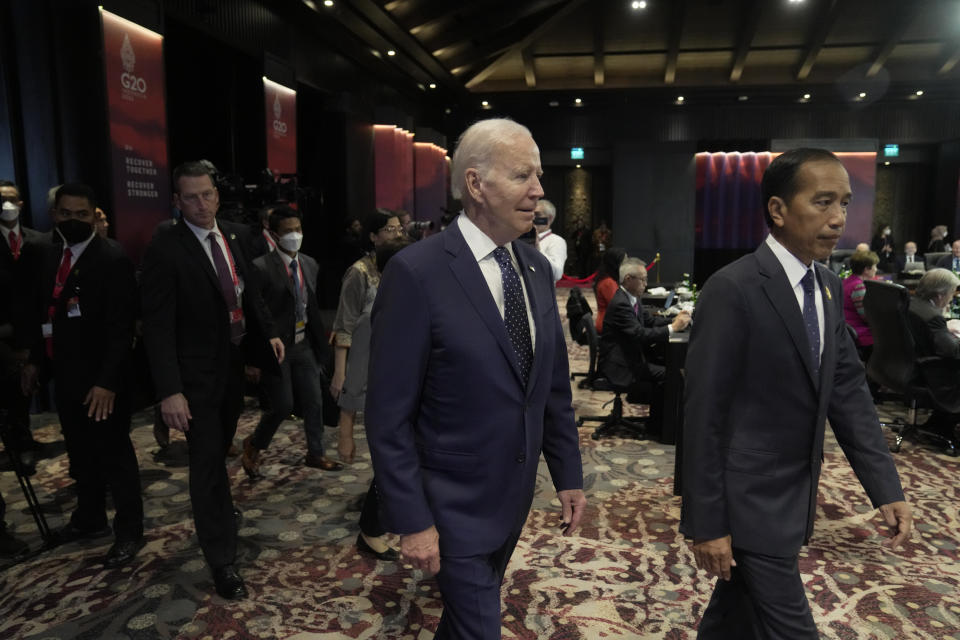 U.S. President Joe Biden, left, walks with Indonesia President Joko Widodo during the G20 leaders summit in Nusa Dua, Bali, Indonesia, Tuesday, Nov. 15, 2022.(AP Photo/Dita Alangkara, Pool)