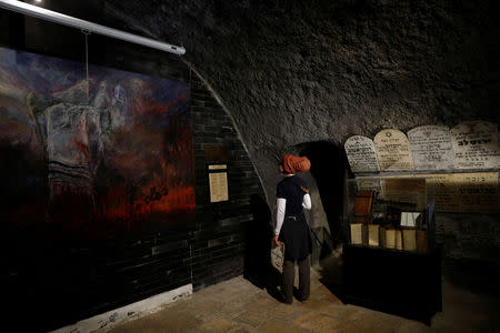 A woman looks at an exhibit during a visit to "The Chamber of the Holocaust", a little-known memorial site for Jewish victims of the Nazi Holocaust, in Jerusalem's Mount Zion January 23, 2019. REUTERS/Ronen Zvulun