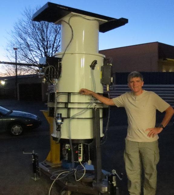 Astro-technologist, John Tonry, with nearly-complete ATLAS 1 telescope at Colorado-based DFM Engineering in late March.