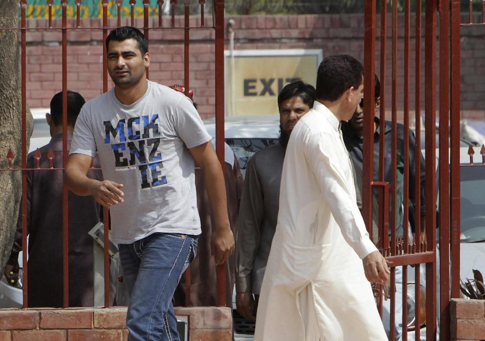 Pakistani cricket player Shahzaib Hasan, left, leaves the Pakistan Cricket Board headquarters in Lahore, Pakistan, Friday, March 17, 2017. Hasan became the fifth Pakistani cricketer to be provisionally suspended by the Pakistan Cricket Board for violating its anti-corruption codes during the recent Pakistan Super League. The PCB said in a statement on Friday that Hasan has been issued a notice of charge and has been provisionally suspended with immediate effect from participating in all forms of cricket. (AP Photo/K.M. Chaudary)