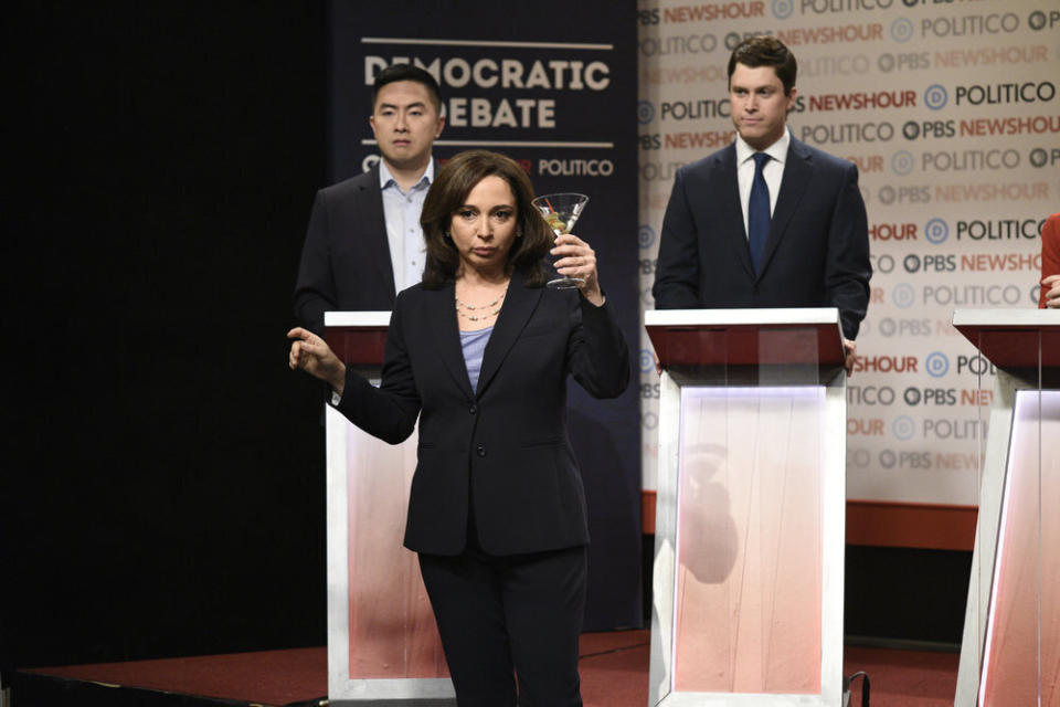 This image released by NBC shows Bowen Yang as Andrew Yang, from left, Maya Rudolph as Kamala Harris, and Colin Jost as Pete Buttigieg during the "Democratic Debate" cold open on "Saturday Night Live" on Dec. 21, 2019. Rudolph won the award for outstanding guest actress in a comedy series during the Creative Arts Emmy Awards on Saturday, Sept. 19, 2020. (Will Heath/NBC via AP)
