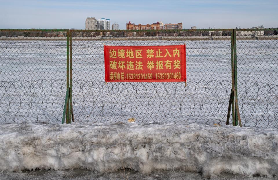 A view of Russia, from China. <a href="https://www.gettyimages.com/detail/news-photo/the-china-russia-border-with-the-russian-city-of-news-photo/1247976467?adppopup=true" rel="nofollow noopener" target="_blank" data-ylk="slk:Anadolu Agency via Getty Images;elm:context_link;itc:0;sec:content-canvas" class="link ">Anadolu Agency via Getty Images</a>