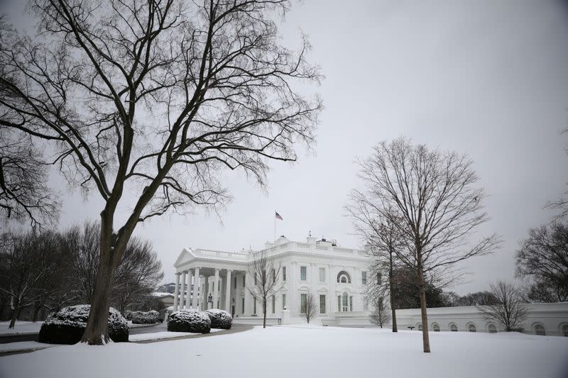 FILE PHOTO: Snow blankets the White House grounds following a storm in Washington