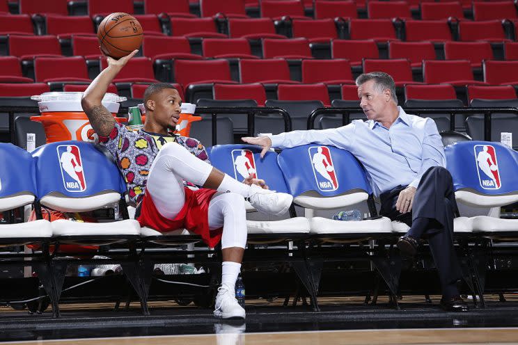 Blazers star Damian Lillard and general manager Neil Olshey try to figure out how to make a splash. (Getty Images)