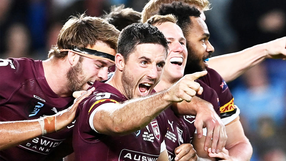 Ben Hunt (pictured) points after the Maroons score against New South Wales.