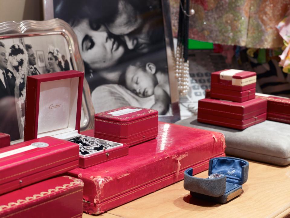 <p>Cartier boxes flanked by photos of Taylor and Burton.</p>