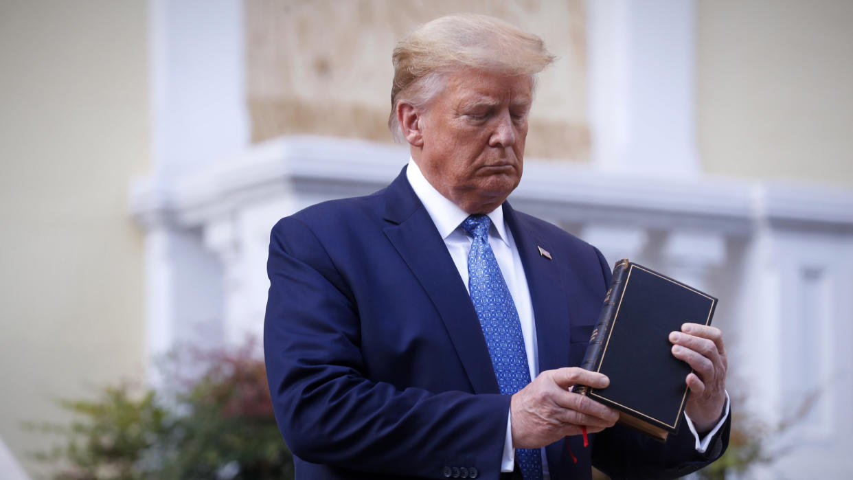  Donald Trump holds a Bible. 