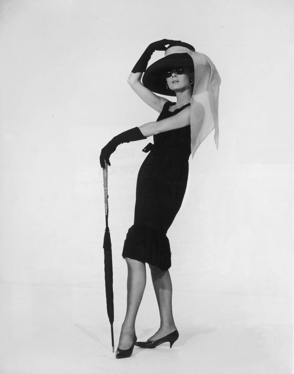 Actress Audrey Hepburn wears the black cocktail dress designed by&nbsp;French couturier Hubert de Givenchy in a promotional portrait for "Breakfast at Tiffany's."