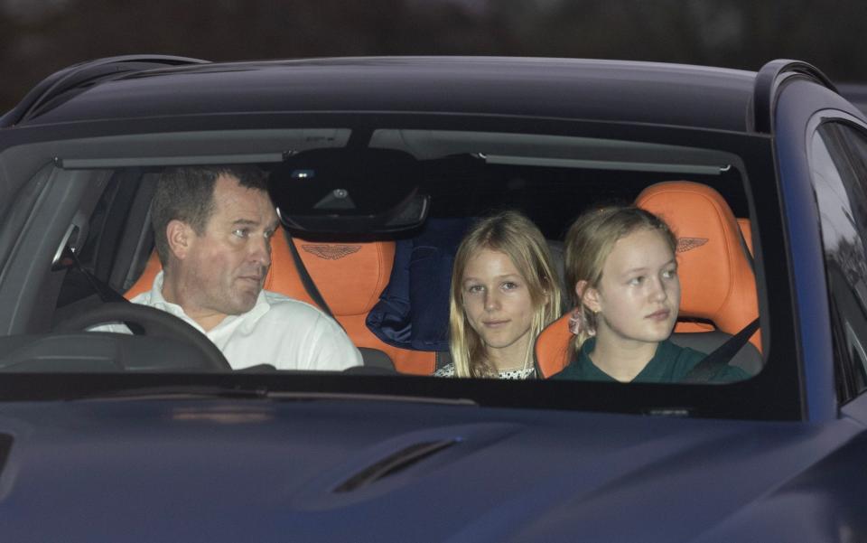 Peter Phillips and his two daughters Savannah and Isla arrive for the royal family's annual Christmas dinner at Windsor Castle