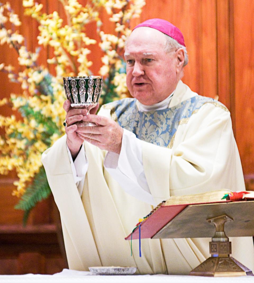 In a 2009 file photo, Bishop Daniel Patrick Reilly prepares for communion during the afternoon service at St. Paul Cathedral.