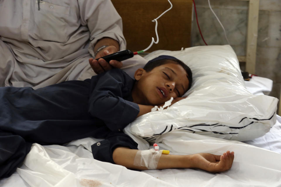 An Injured boy lies on the bed at a hospital after Sunday's suicide bomber attack, in the Bajur district of Khyber Pakhtunkhwa, Pakistan, Monday, July 31, 2023. A suicide bomber blew himself up at a political rally in a former stronghold of militants in northwest Pakistan bordering Afghanistan on Sunday, killing and wounding multiple people in an attack that a senior leader said was meant to weaken Pakistani Islamists. (AP Photo/Mohammad Sajjad)