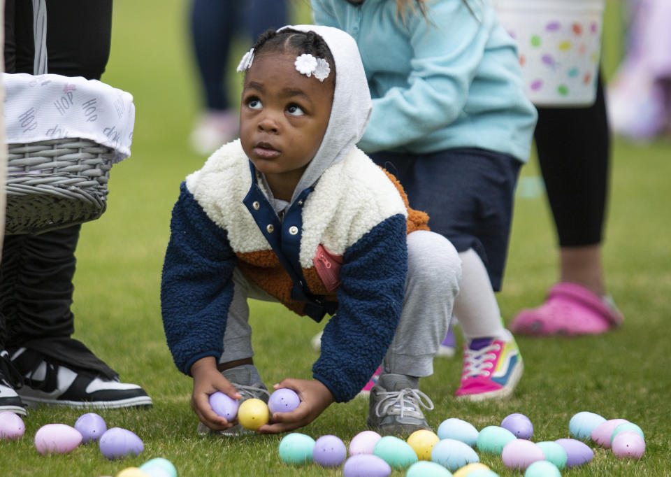 FILE - A youngster collects Easter eggs during an egg hunt at Easterfest at the Bowling Green Ballpark in Bowling Green, Ky., April 8, 2023. In 2024, for the second year in a row consumers have faced sticker shock ahead of Easter and Passover, events in which eggs play prominent roles. (Grace Ramey/Daily News via AP, File)