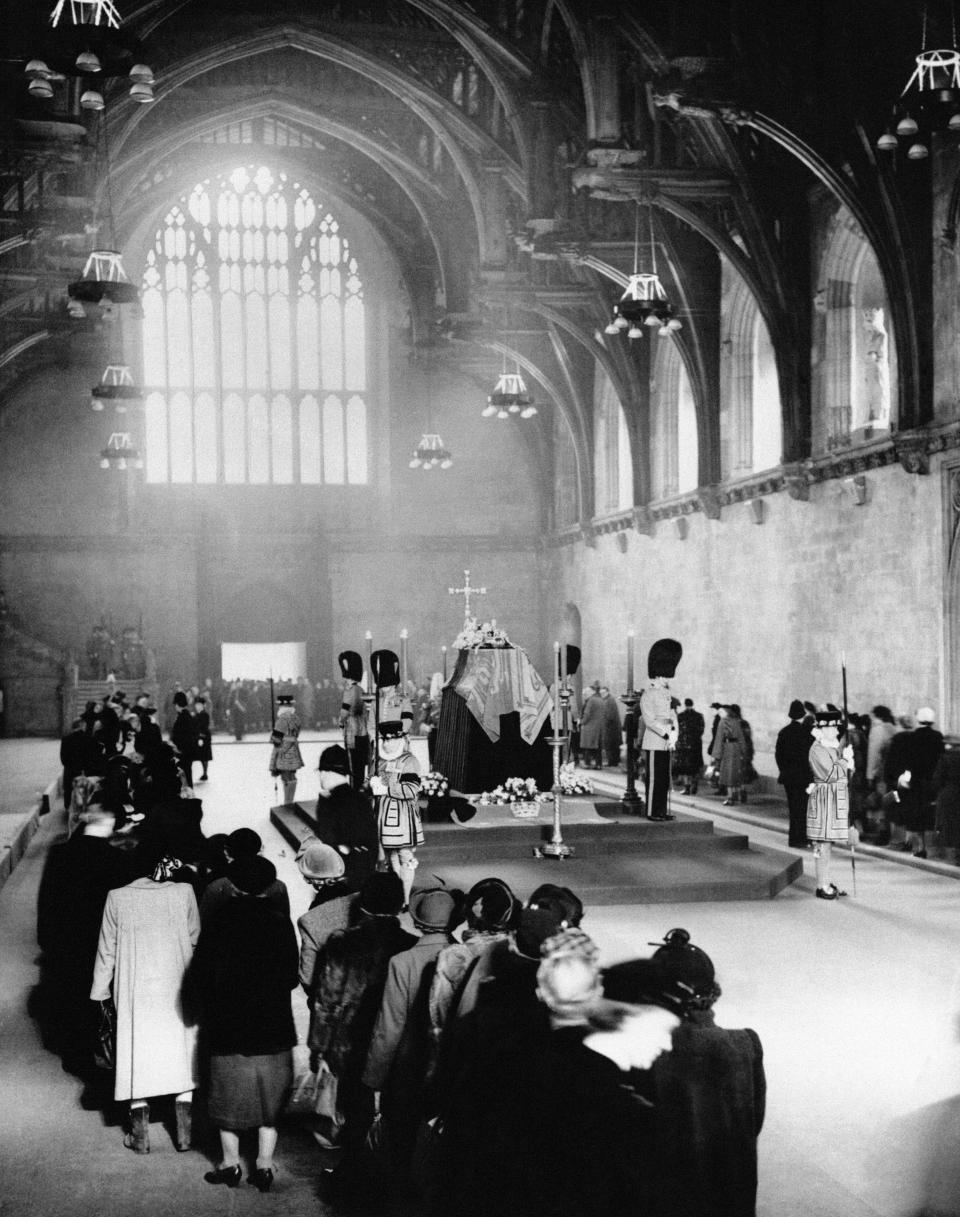 Mourners filing past the coffin of King George VI inside Westminster Hall after his death in 1952