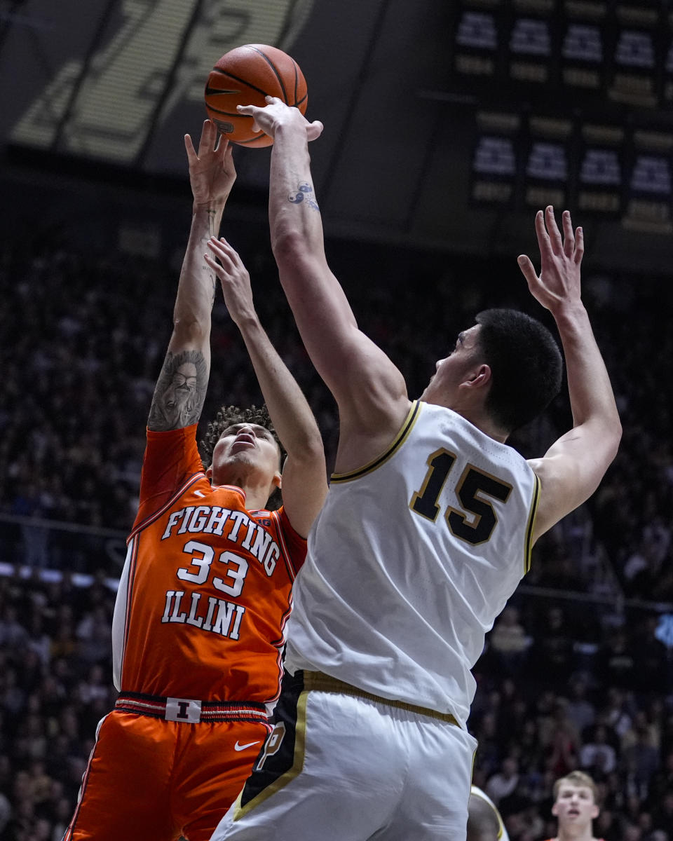 Purdue center Zach Edey (15) blocks the shot of Illinois forward Coleman Hawkins (33) during the first half of an NCAA college basketball game in West Lafayette, Ind., Friday, Jan. 5, 2024. (AP Photo/Michael Conroy)