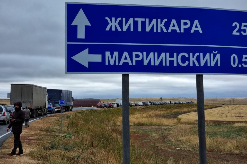 Cars queuing to cross the border into Kazakhstan at the Mariinsky border crossing, about 400 kilometers (250 miles) south of Chelyabinsk, Russia.  (AP)