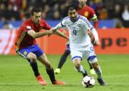 Football Soccer - Spain v Israel - 2018 World Cup Qualifying European Zone - Group G - El Molinon Stadium, Gijon, Spain, 24/3/17 Spain's Sergio Busquets (L) and Israel's Lior Refaelov in action. REUTERS/Eloy Alonso