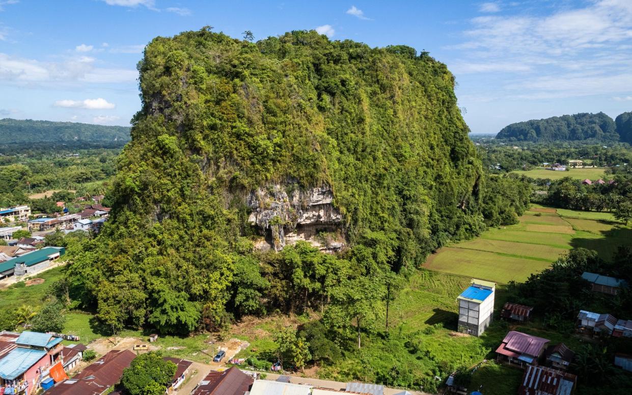 Karampuang Hill, where the cave is located