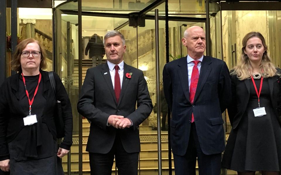 Dr Richard Freeman (second left) where he posed for pictures with QC, Mary O’Rourke (left) and his defence team after appearing at a hearing at the Medical Practitioners Tribunal Service (MPTS) in Manchester - PA