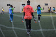 In this Sunday, Oct. 27, 2019 photo, Sudanese al-Tahadi women team practices in Omdurman, Khartoum's twin city, Sudan. The women's soccer league has become a field of contention as Sudan grapples with the transition from three decades of authoritarian rule that espoused a strict interpretation of Islamic Shariah law. (AP Photo)
