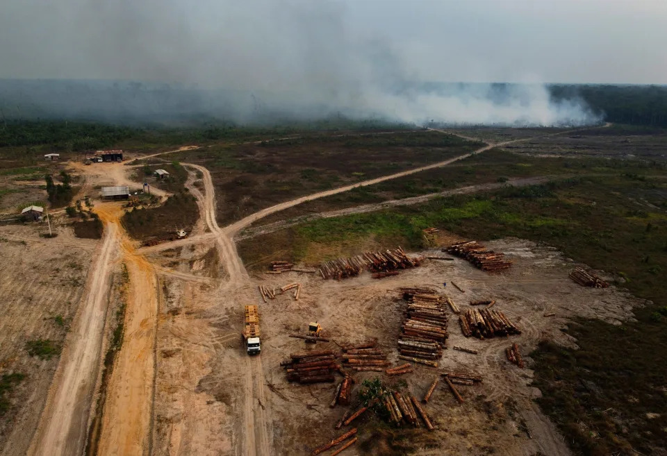 FILE - Smoke rises from a fire near a logging area in the Transamazonica highway region, in the municipality of Humaita, Amazonas state, Brazil, Sept. 17, 2022. Brazil has a major role to play in addressing climate change as home to the world's largest rainforest, but after the Sunday, Oct. 2, election, the subject is less likely to come up than ever. (AP Photo/Edmar Barros, File) ORG XMIT: CLI301