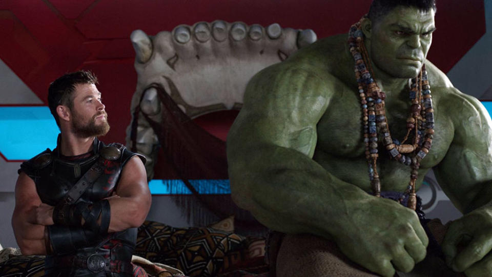 Chris Hemsworth (Thor) and Mark Rufallo (The Hulk) sitting on Hulk's giant bed in Thor: Ragnarok