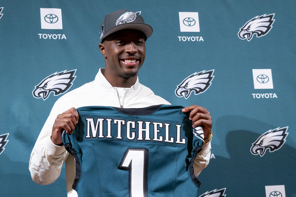 Philadelphia Eagles first-ound draft pick Quinyon Mitchell holds up a jersey during a news conference with the NFL football team in Philadelphia, Friday, April 26, 2024. (AP Photo/Chris Szagola)