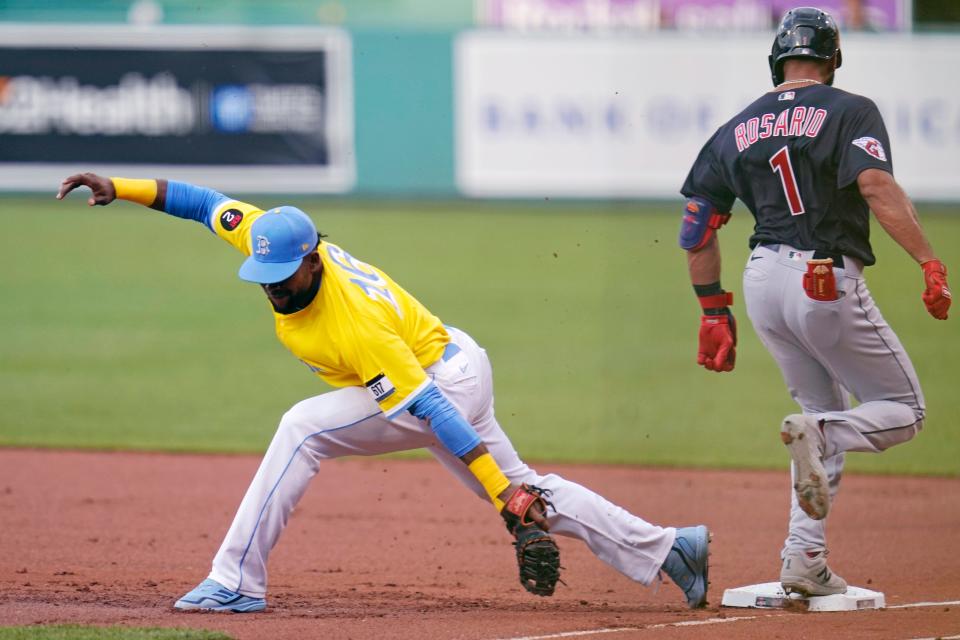 Cleveland Guardians' Amed Rosario (1) legs out a ground-ball single as Boston Red Sox first baseman Franchy Cordero, left, pulls away from the base during the first inning of a baseball game at Fenway Park, Wednesday, July 27, 2022, in Boston. (AP Photo/Charles Krupa)