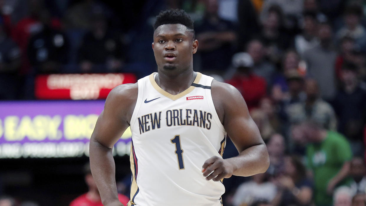 New Orleans Pelicans forward Zion Williamson (1) runs down court in the first half of an NBA basketball game against the Boston Celtics in New Orleans, Sunday, Jan. 26, 2020. (AP Photo/Gerald Herbert)