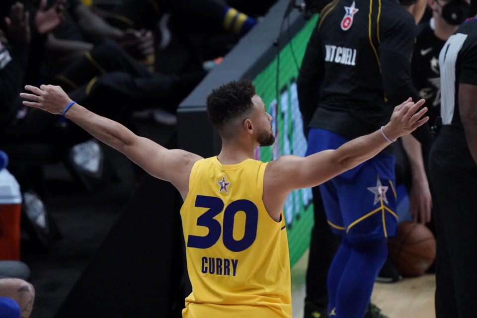 Golden State Warriors guard Stephen Curry celebrates during the 3-point contest at basketball's NBA All-Star Game in Atlanta, Sunday, March 7, 2021. (AP Photo/Brynn Anderson)