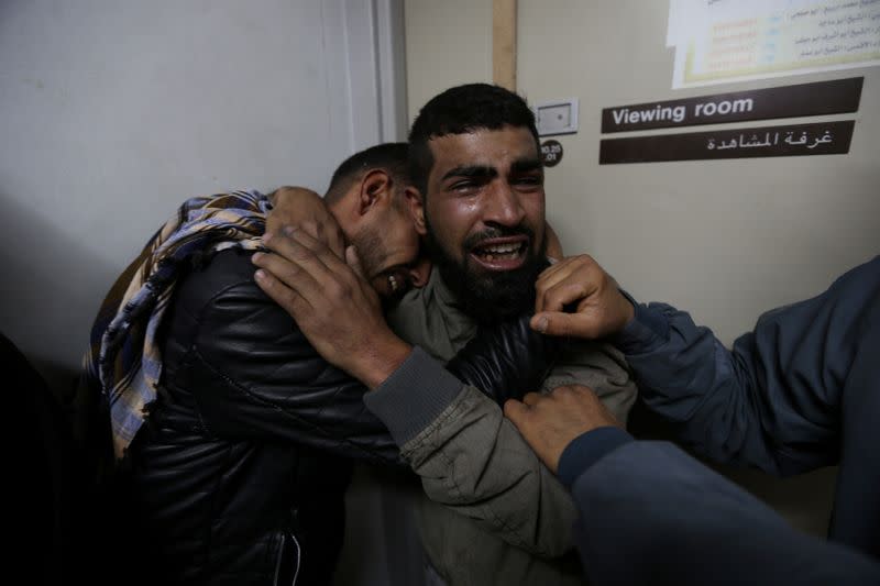 Relatives of a Palestinian teenager who was killed near the border fence, mourn at the hospital in the southern Gaza Strip