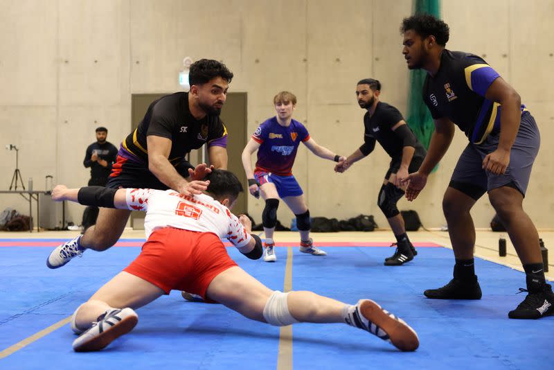 Players take part in a Kabaddi match during a training session in London