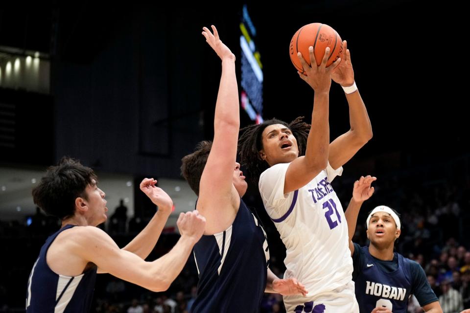 Pickerington Central's Devin Royal is defended by Akron Hoban’s Sam Greer during the Division I state final.