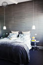 It’s all about texture in this bedroom with feature wall, bedside tables and bedding offering contrasting textures.