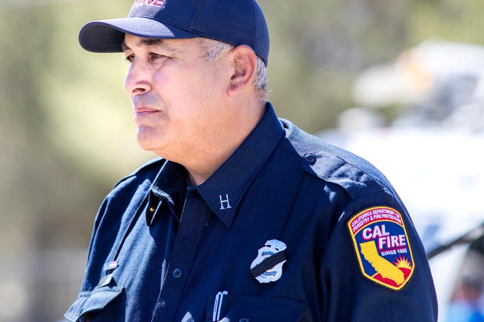 Cal Fire PIO Captain Richard Cordova speaks to members of the media outside the crash site where two contract Cal Fire helicopters collided midair Sunday evening, killing one contract pilot and two Cal Fire employees, in Cabazon, Calif., on Monday, August 7, 2023.
