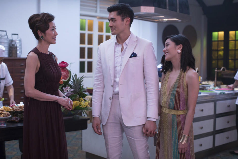 This image released by Warner Bros. Entertainment shows Michelle Yeoh, from left, Henry Golding and Constance Wu in a scene from the film "Crazy Rich Asians." The cast was nominated for a SAG Award for best ensemble. The SAG Awards will be held Jan. 27 and broadcast live by TNT and TBS. This year's show will honor Alan Alda with the Screen Actors Guild Life Achievement Award. (Sanja Bucko/Warner Bros. Entertainment via AP)