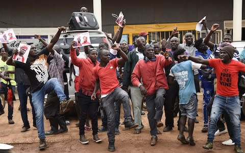 Supporters of Bobi Wine celebrate his release on bail earlier this week - Credit: AFP