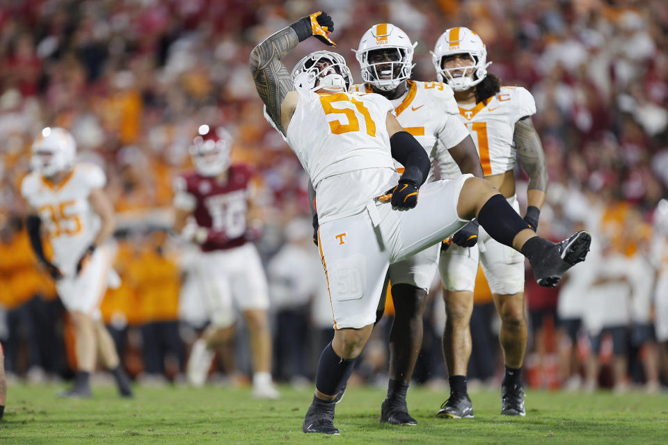 NORMAN, OKLAHOMA - SEPTEMBER 21:  Defensive lineman Jaxson Moi #51 of the Tennessee Volunteers celebrates his sack against the Oklahoma Sooners with defensive back Christian Harrison #5 and linebacker Keenan Pili #11 in the fourth quarter at Gaylord Family Oklahoma Memorial Stadium on September 21, 2024 in Norman, Oklahoma.   Tennessee won 25-15. (Photo by Brian Bahr/Getty Images)