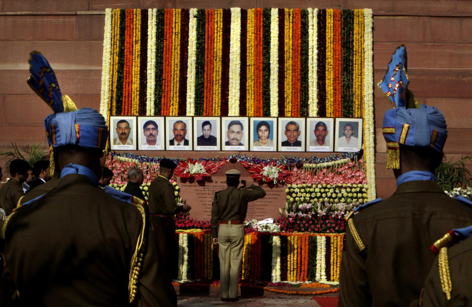 Indian paramilitary soldiers pay homage to the victims of the 2001 attack on the Indian parliament in New Delhi. (AP Photo/Manish Swarup)