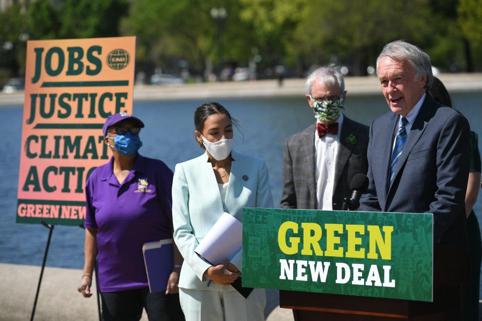 Senator Ed Markey, D-MA, and Representative Alexandria Ocasio-Cortez(D-NY) speak during a press conference to re-introduce the Green New Deal in front of the US Capitol in Washington, DC on April 20, 2021. (Photo by MANDEL NGAN / AFP) (Photo by MANDEL NGAN/AFP via Getty Images) ORG XMIT: 0 ORIG FILE ID: AFP_98D8LR.jpg