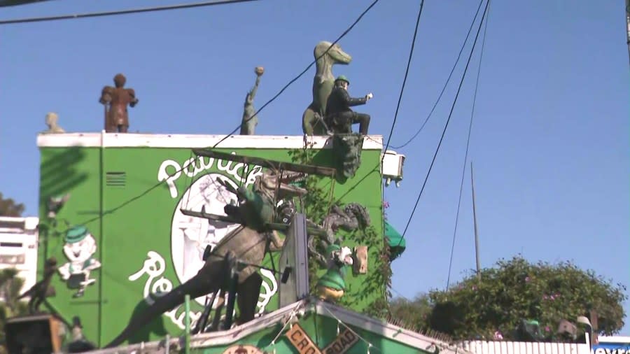 Patrick's Roadhouse is famous for its bright-green exterior and plenty of eye-catching kitschy sculptures. (KTLA)