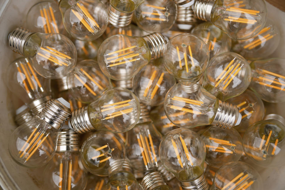 Light bulbs rest in a bucket as Mahya masters work on a lights messages installation at the top of one of the minarets of the Suleymaniye mosque, in Istanbul, Turkey, Wednesday, March 6, 2024. Mahya is the unique Turkish tradition of stringing religious messages and designs between minarets. (AP Photo/Emrah Gurel)