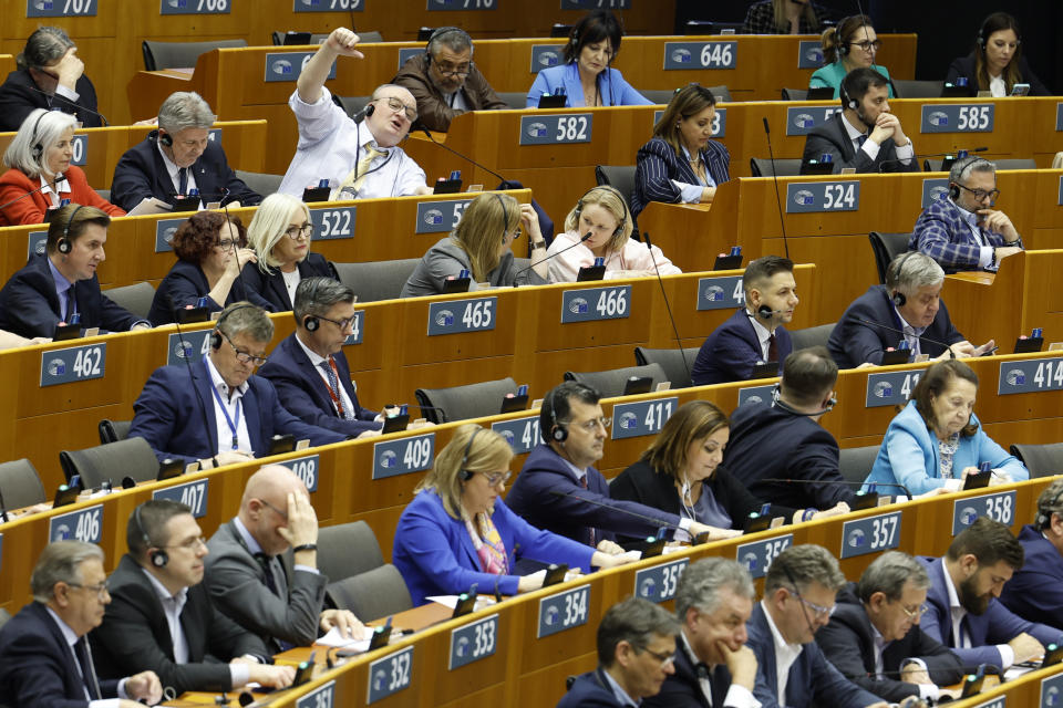 Members of European Parliament participate in a series of votes as they attend a plenary session at the European Parliament in Brussels, Wednesday, April 10, 2024. Lawmakers are voting Wednesday on a major revamp of the European Union's migration laws aiming to end years of division over how to manage the entry of thousands of people without authorization and deprive the far-right of a vote-winning campaign issue ahead of June elections. (AP Photo/Geert Vanden Wijngaert)