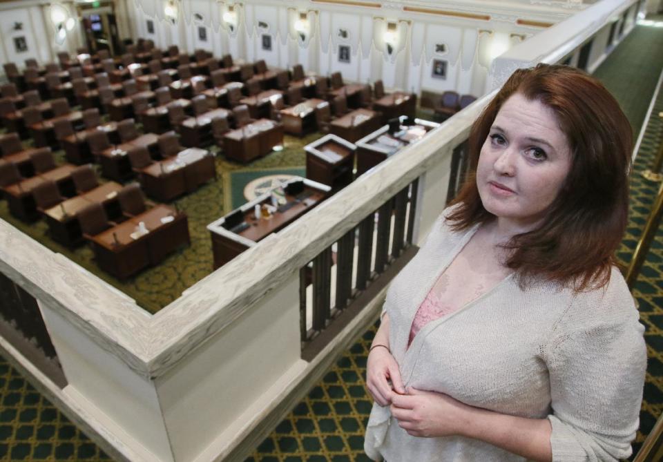Carol Johnson poses for a photo in the House gallery in the Capitol in Oklahoma City, Thursday, Feb. 9, 2017. Johnson, who landed a position as a legislative assistant in the Oklahoma House of Representatives, has accused state Rep. Dan Kirby, of sexual harassment. Kirby, 58, resigned last week in the face of likely expulsion after Johnson testified before an investigating panel. (AP Photo/Sue Ogrocki)