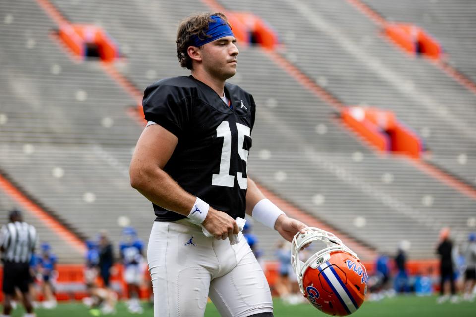 Florida Gators quarterback Graham Mertz (15) walks off the field with his helmet off during fall football practice at Ben Hill Griffin Stadium at the University of Florida in Gainesville, FL on Saturday, August 5, 2023. [Matt Pendleton/Gainesville Sun]