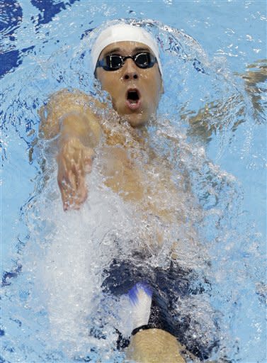 USA's Michael Phelps competes in a heat of the men's 400-meter individual medley at the Aquatics Centre in the Olympic Park during the 2012 Summer Olympics in London, Saturday, July 28, 2012. (AP Photo/Lee Jin-man)