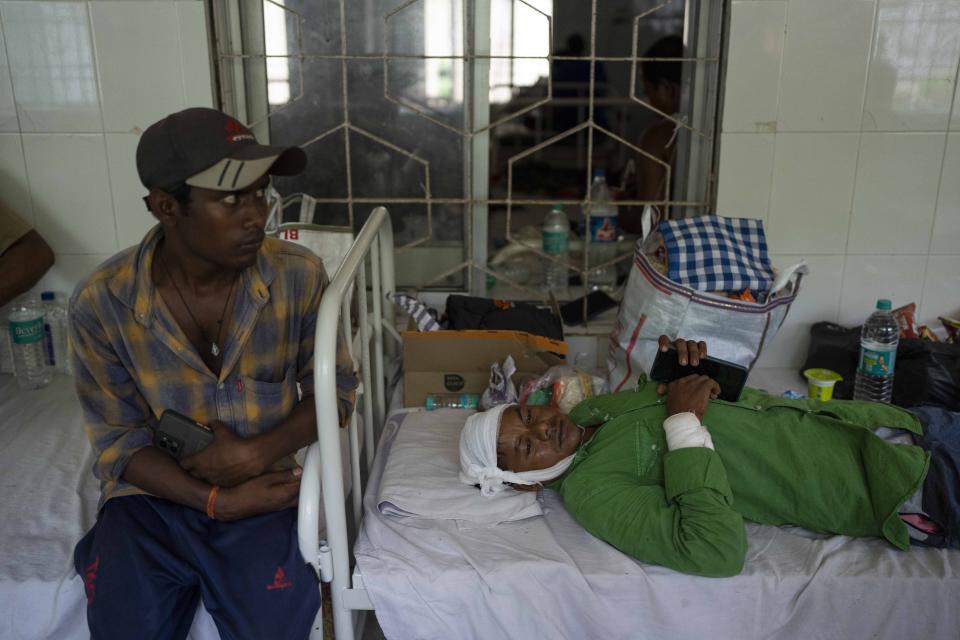A passenger who was injured in Friday's train accident lies on a bed at a hospital in Balasore district, in the eastern state of Orissa, India, Sunday, June 4, 2023. The train derailment in eastern India that killed more than 300 people and injured hundreds more was caused by an error in the electronic signaling system that led a train to wrongly change tracks, India’s railways minister said Sunday. (AP Photo/Rafiq Maqbool)